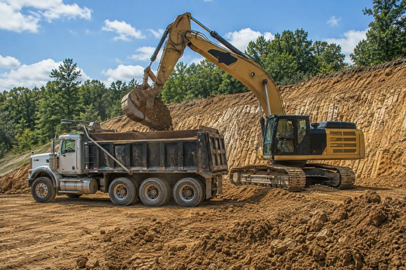 Excavation cost — Per hour, per cubic yard, and what moves a bid.